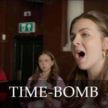 photo of a brunette woman singing with the title Time-Bomb